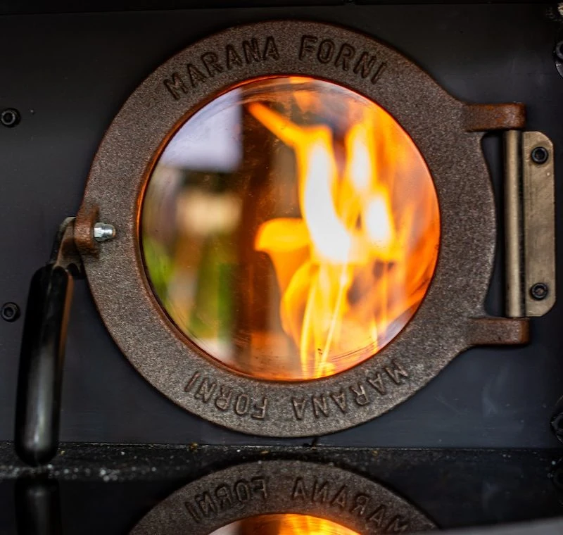 Rotating wood fired pizza oven